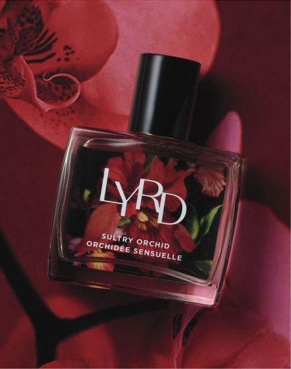 LYRD perfume by Avon styled with floral accents on vanity table